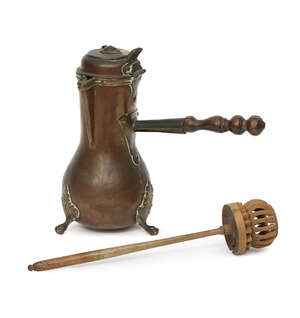 
	
		A Dutch copper chocolate pot, 18th century, of pear shape with a triangular lip, on leaf...