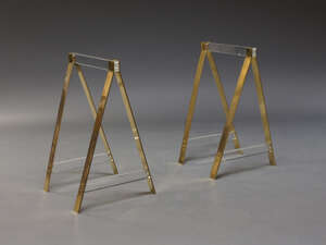
	
		A pair of Perspex and brass table bases, c.1970s, of A-frame shape, with Perspex...