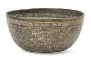 
	
		A Chinese bronze singing bowl, late 19th/20th century, decorated to the exterior with two...
