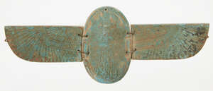 A large Egyptian-style blue faience winged scarab, the separately-made body and two wings perforated for attachment, the details of the beetle and feathered wi