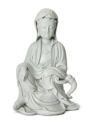 A large Chinese blanc-de-chine figure of Guanyin
20th century
Modelled seated wearing flowing...
