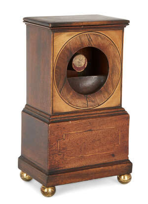 
	
		A late Regency mahogany pocket watch stand, early 19th century, the circular aperture...