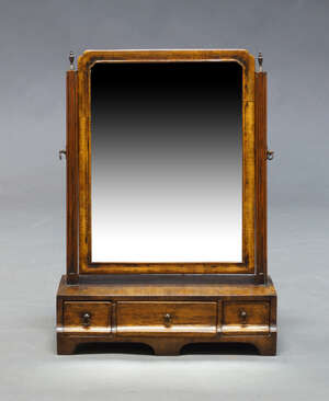 
	
		A George III mahogany and ebony strung dressing table mirror, the rectangular swing frame...
