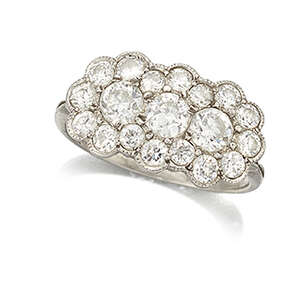 
	
		A Belle Epoque platinum and diamond ring, designed as an old-brilliant-cut diamond triple...