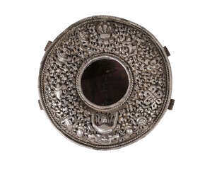
	
		A Tibetan silver and copper backed Gau, 19th century, the cover pierced and repousse...