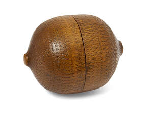 
	
		A treen box modelled as a lemon, late 19th century, 7cm long, together with a boxwood...