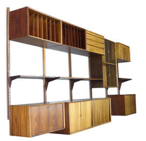 
	
		Poul Cadovius (1911-2011), a rosewood 'Royal System' wall storage system for Cado   
		