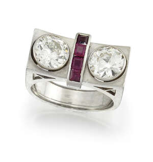 
	
		An Art Deco, gold, diamond and ruby ring, of odeonesque design, composed of two...