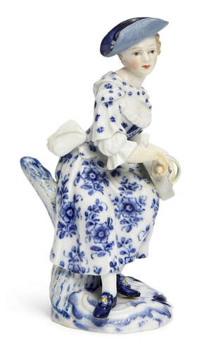 
	
		A Meissen blue and white porcelain figure of a lady playing a Hurdy-gurdy from the...