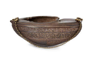 
	
		A Qajar coco de mer kashkul, inscribed with the Throne verse (Qur'an II, v.255, ayat...