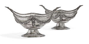 
	
		A pair of pierced silver oval baskets, London c.1891 and c.1900, C.S Harris & Sons, each...