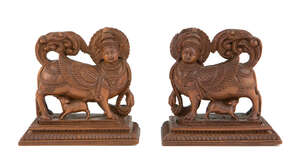 
	
		Two carved wood figures of Kamadhenu, the wish-granting cow, Mysore, India, 19th century,...