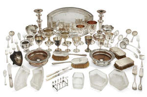 
	
		A quantity of silver plate, including: a pair of candlesticks; a small toast rack; a pair...