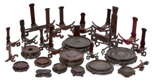 
	
		A large Chinese hardwood circular stand, 20th century, 21.5cm diameter, with ten other...