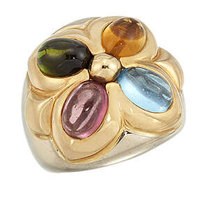 
	
		A four-gem ring, by Bulgari, of quatrefoil design, set with oval cabochon pink...
