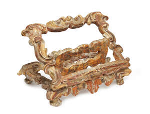 An Italian carved wood book or music stand, parts 18th century, with adjustable scroll-carved...