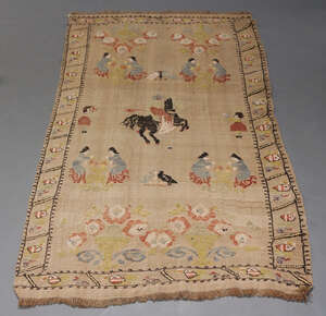 
	
		A Chinese embroidered carpet, mid-20th century, centered with a rider on horseback...
