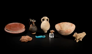 A collection of pottery vessels and objects, including a Cypriot Bronze Age hemispherical bowl,...