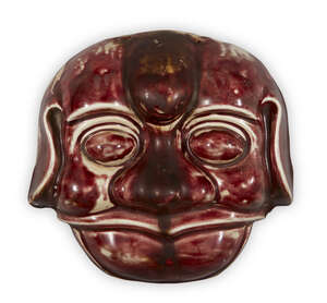 
	
		A Chinese copper-glazed mask of a dog, 19th or 20th century, with exaggerated features,...