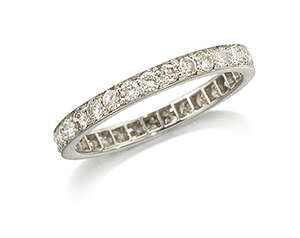 
	
		A diamond eternity ring,  composed of a single line of circular-cut diamonds, ring size...