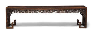 
	
		A Chinese rosewood long bench, mid-19th century, of rectangular form with profusely...