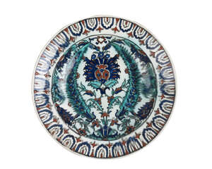 
	
		An Iznik-style pottery dish, Kutahya, Turkey, late 18th-19th century, of typical form,...