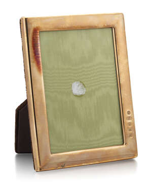 
	
		A 9ct gold mounted photo frame, the plane gold frame with plush brown fabric easel back...