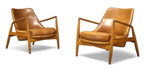 
	
		After Ib Kofod-Larsen (Danish 1921-2003), a pair of Seal lounge chairs produced by Brdr...