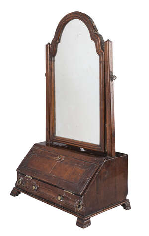 
	
		A Queen Anne/George I walnut dressing mirror, the plate with arched top on square column...