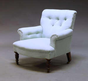 
	
		A Victorian button back armchair by Gillows of Lancaster, upholstered in pale blue...