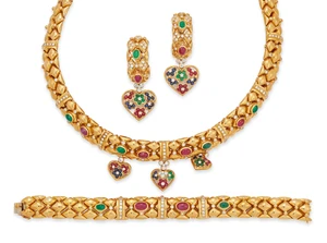 A diamond and gem-set bracelet, earrings and necklace suite, the necklace designed as...