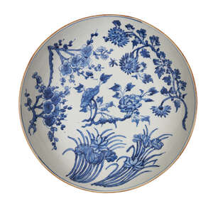 
	
		A large Chinese porcelain dish, 19th century, painted in underglaze blue with...
