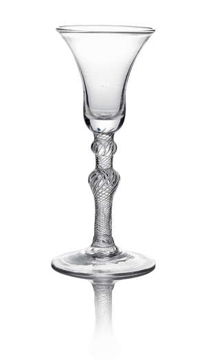 A Continental wine glass, c.1740, the bell bowl above a ball and inverted baluster knop, with air twist stem, on a conical foot, 18.2cm high
		 
		 