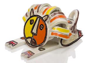 
	
		Bruno Gambone (b.1936), a pottery lion 
		 
		c.1960, signed to base 
		 
		A pale...