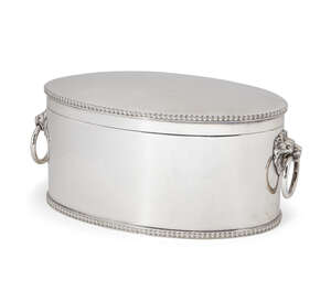 An oval silver biscuit box, Sheffield, 1928, Atkin Brothers, with applied lion mask ring handles to either side and gadroon decoration to both hinged lid and f
