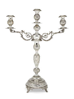 
	
		A silver three-branch candelabra, London, c.1919, Rosenzweig, Taitelbaum & Co., the...