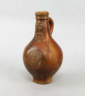 
	
		A Continental salt glazed stoneware Bellarmine jug, decorated to the neck with a bearded...