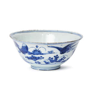 A large Chinese porcelain bowl, Xuande mark, Wanli period, painted in underglaze blue with a continuous landscape scene of birds in flight amid chrysanthemum, 