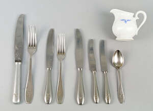 
	
		A group of German WWII flatware, including 7 by WMF and a table knife signed F.C.U.V,...