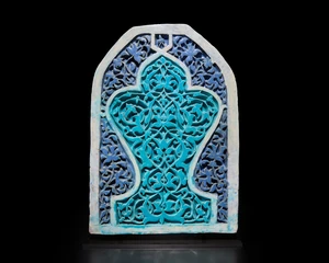 A large turquoise and cobalt blue glazed carved pottery tile or panel,&nbsp;&nbsp;Timurid western Central...