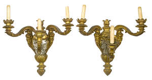 
	
		A pair of French gilt-bronze three-light wall appliques, early 20th century, the...