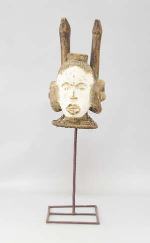 
	
		A Tribal carved wood and coloured mask, Igbo, Nigeria, early 20th century, the mask with...