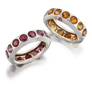 
	
		A pair of gem eternity rings, set with either a line of circular-cut citrines or...