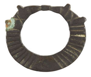 An iron Terret (reign ring), possibly Iron Age, and a small perforated vessel, ring 5.1cm. diam. (2)
		Provenance: Private UK collection acquired by the vendo
