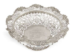 A large pierced silver presentation bowl, Sheffield, c.1917, James Dixon & Sons., retailed by Jamieson & Carry, Aberdeen, the bowl of shaped circular form with