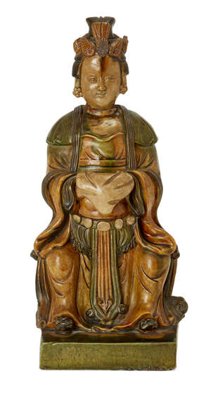 A Chinese stoneware sancai-glazed figure of Guanyin
Qing dynasty, 18th/19th century
Modelled...