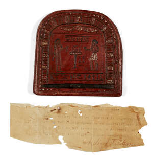 A reproduction Egyptian round-topped stele, of red glazed pottery with an offering scene and pseudo hieroglyphic inscription, 11 x 11.4cm, Not Ancient, accompa