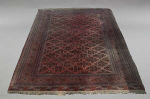 
	
		A large woolen carpet, Iran, early 20th century, the central reserve decorated with...
