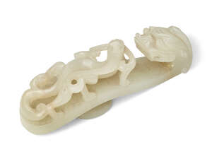 
	
		A Chinese pale green jade dragon belt hook, 18th century, carved with a dragon head...
