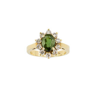 
	
		An 18ct gold, diamond and green tourmaline cluster ring, the oval mixed cut green...